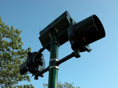 Closeup of one crosswalk traffic beacon.